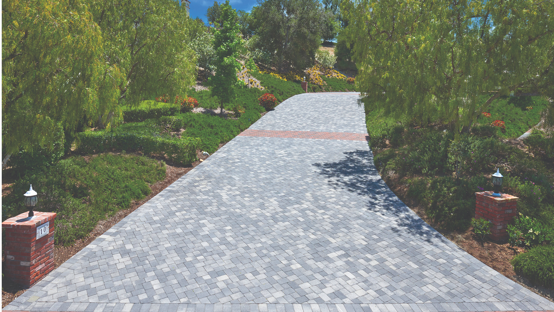 Driveway features Antique Cobble I and II in a Gray-Charcoal blend installed in an 