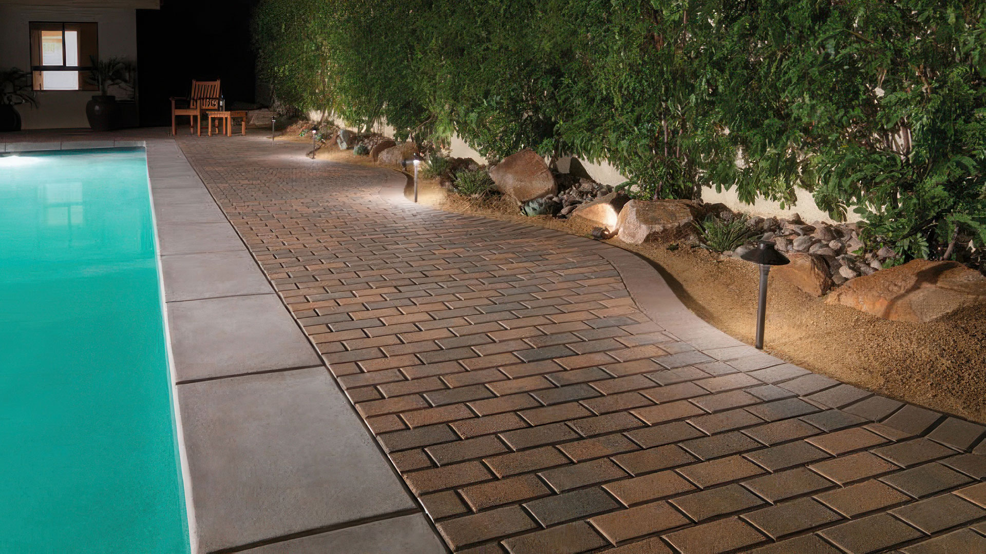 Holland Paving stones installed in a running bond pattern for outdoor pool and pool deck.