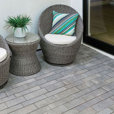 Aqualina paving stones installed in a random runner pattern on a outside patio.