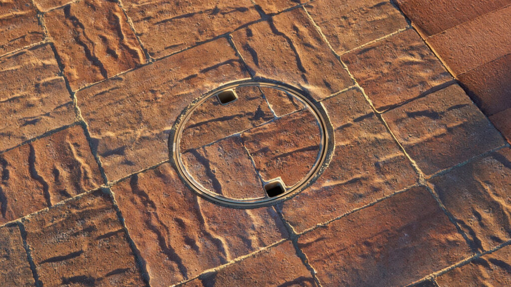 Close-up view of a pool deck with Cream-Terracotta-Brown distressed Slate Stone Combo in an ashlar pattern. A circular skimmer cover blends seamlessly with the pavers, using the same field stone for a low-profile look. Cream-Terracotta-Brown Bullnose coping lines the pool edge at the far right.