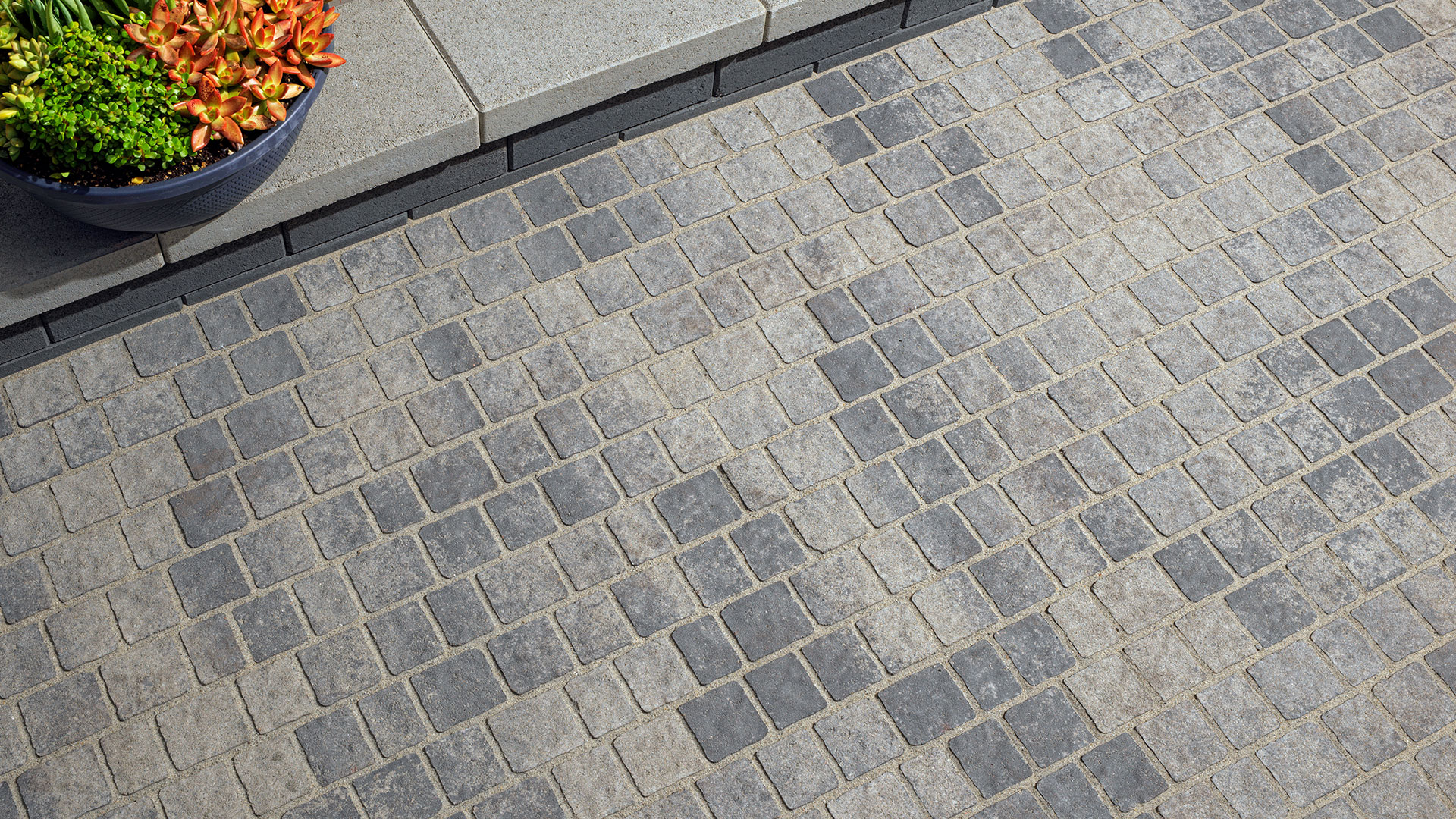 New blended gray charcoal Torino paving stones installed in a random runner pattern.
